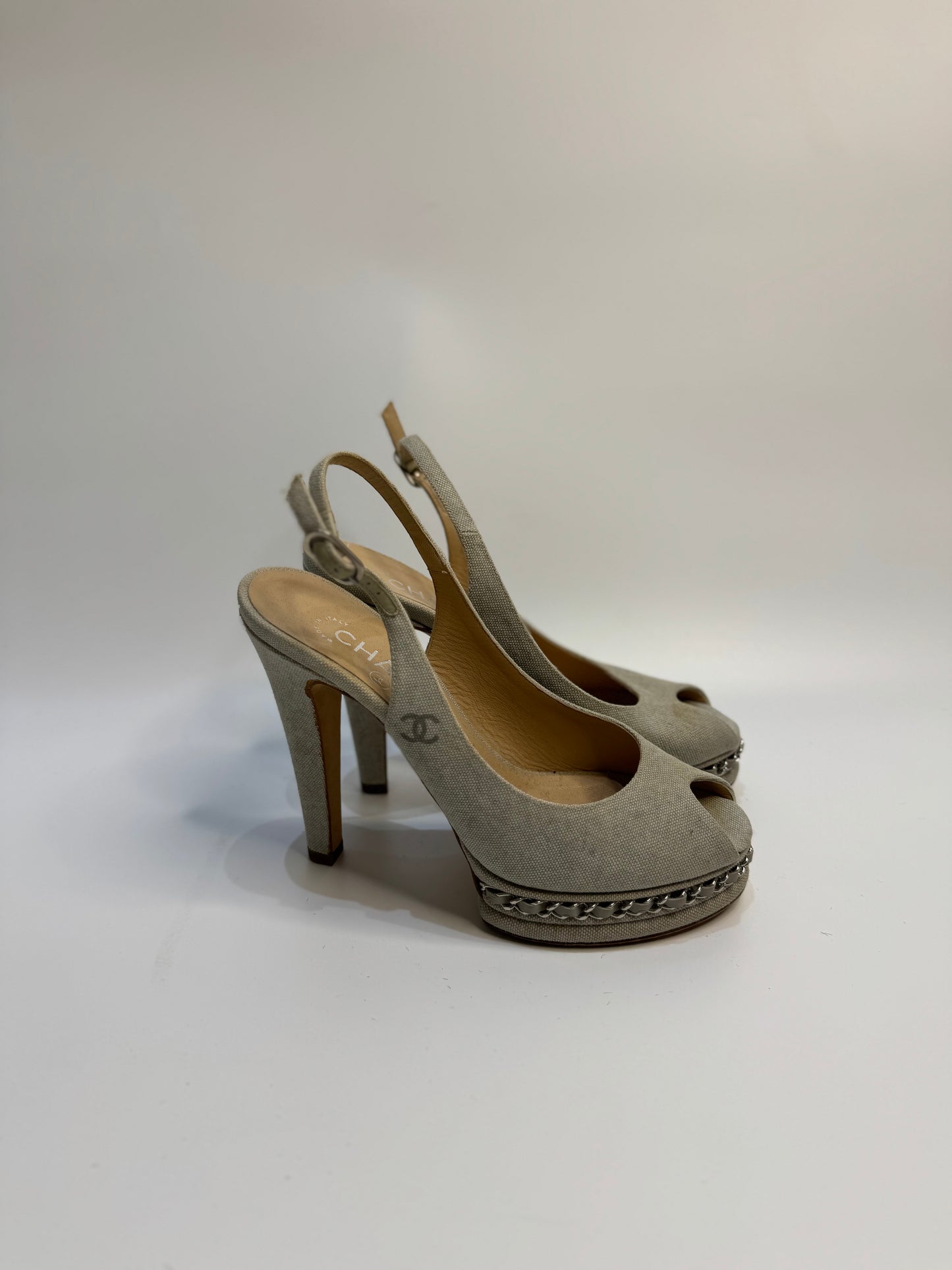 CHANEL Grey Canvas Peep Toe Slingback Platform Sandals, size 38. The shoes feature a peep toe design with a grey canvas upper, a platform heel, and a slingback strap.