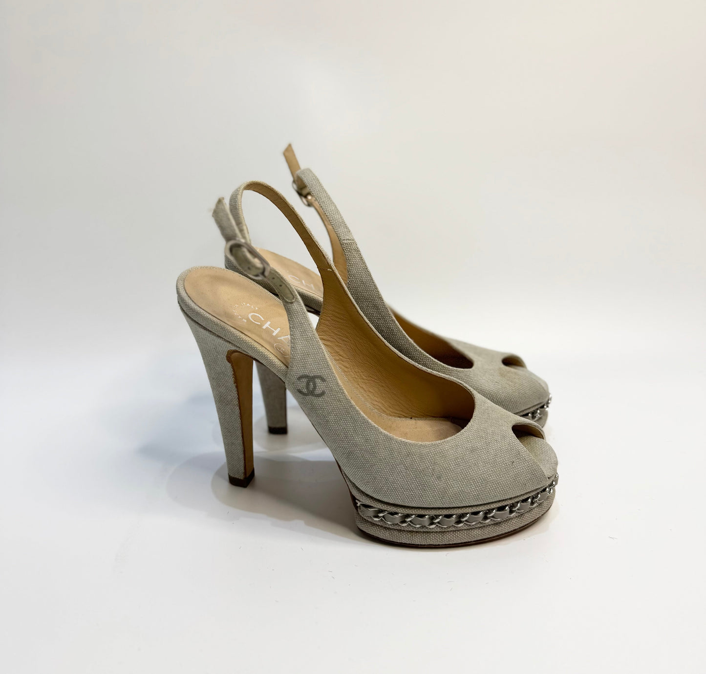 Side view of CHANEL Grey Canvas Peep Toe Sling Back Platform Sandals, size 38. The image highlights the side profile of the shoes, showcasing the platform heel, peep toe design, and adjustable sling back strap.