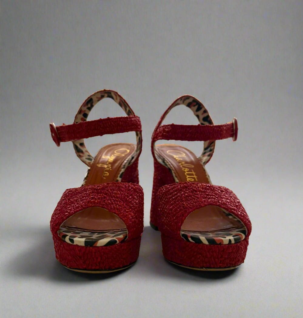 Red Charlotte Olympia raffia platform heels with ankle strap, featuring a chunky heel and leopard-print lining, worn only once, size IT 38, made in Italy.