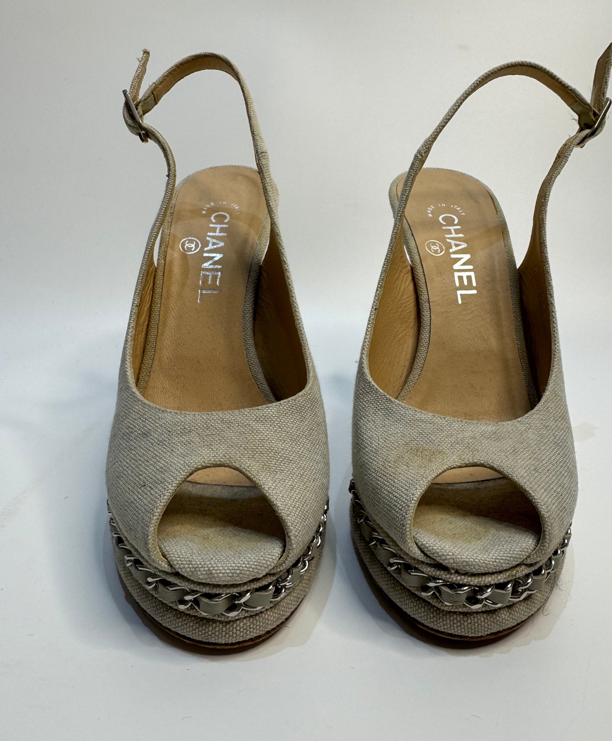 Front view of CHANEL Grey Canvas Peep Toe Sling Back Platform Sandals, size 38. The shoes feature a peep toe design with a grey canvas upper, a platform heel, and a slingback strap.