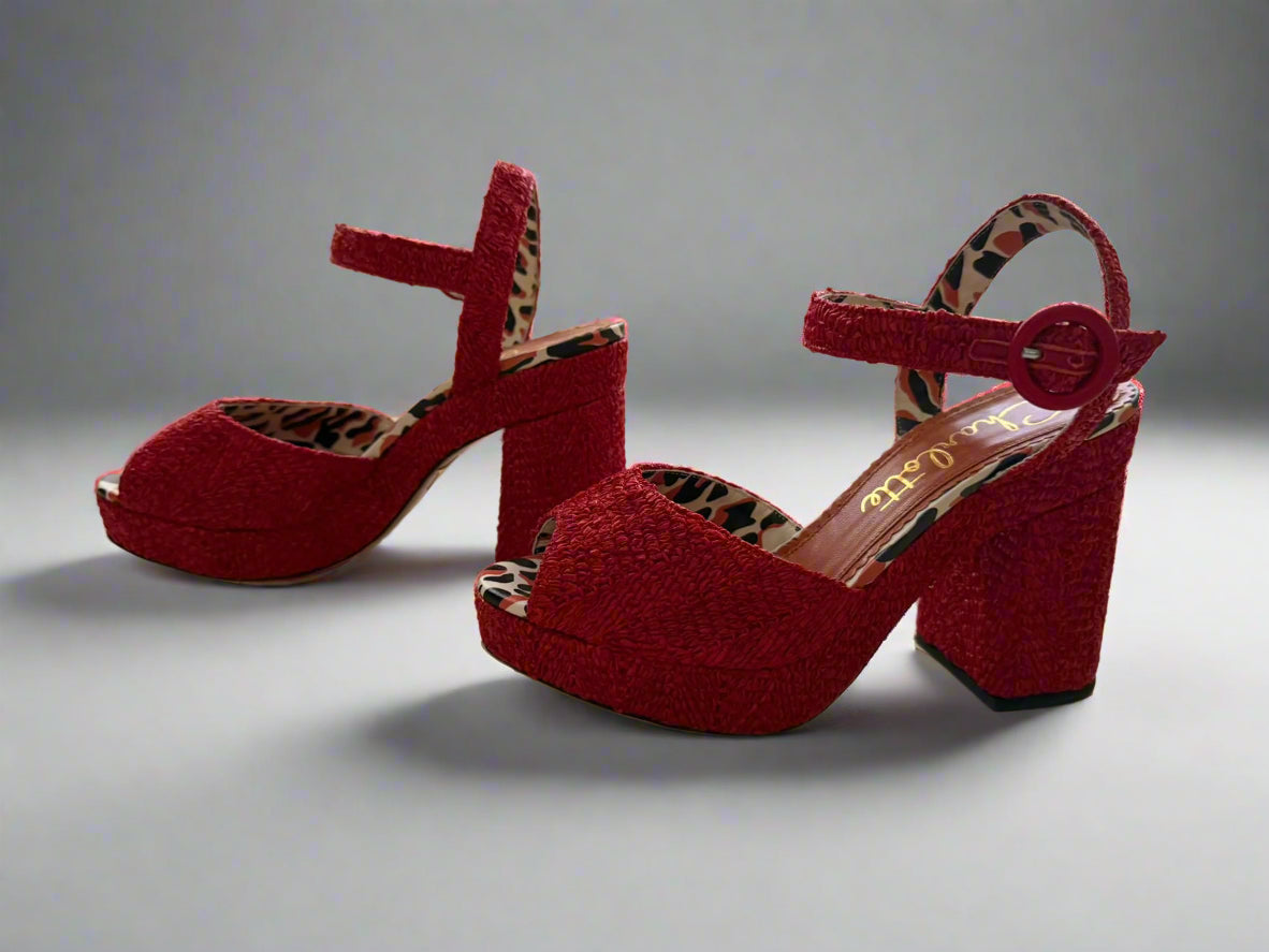 Red Charlotte Olympia raffia platform heels with ankle strap, featuring a chunky heel and leopard-print lining, worn only once, size IT 38, made in Italy.
