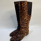 Side angle of the leopard print boots, highlighting the soft calf hair texture and knee-high design.