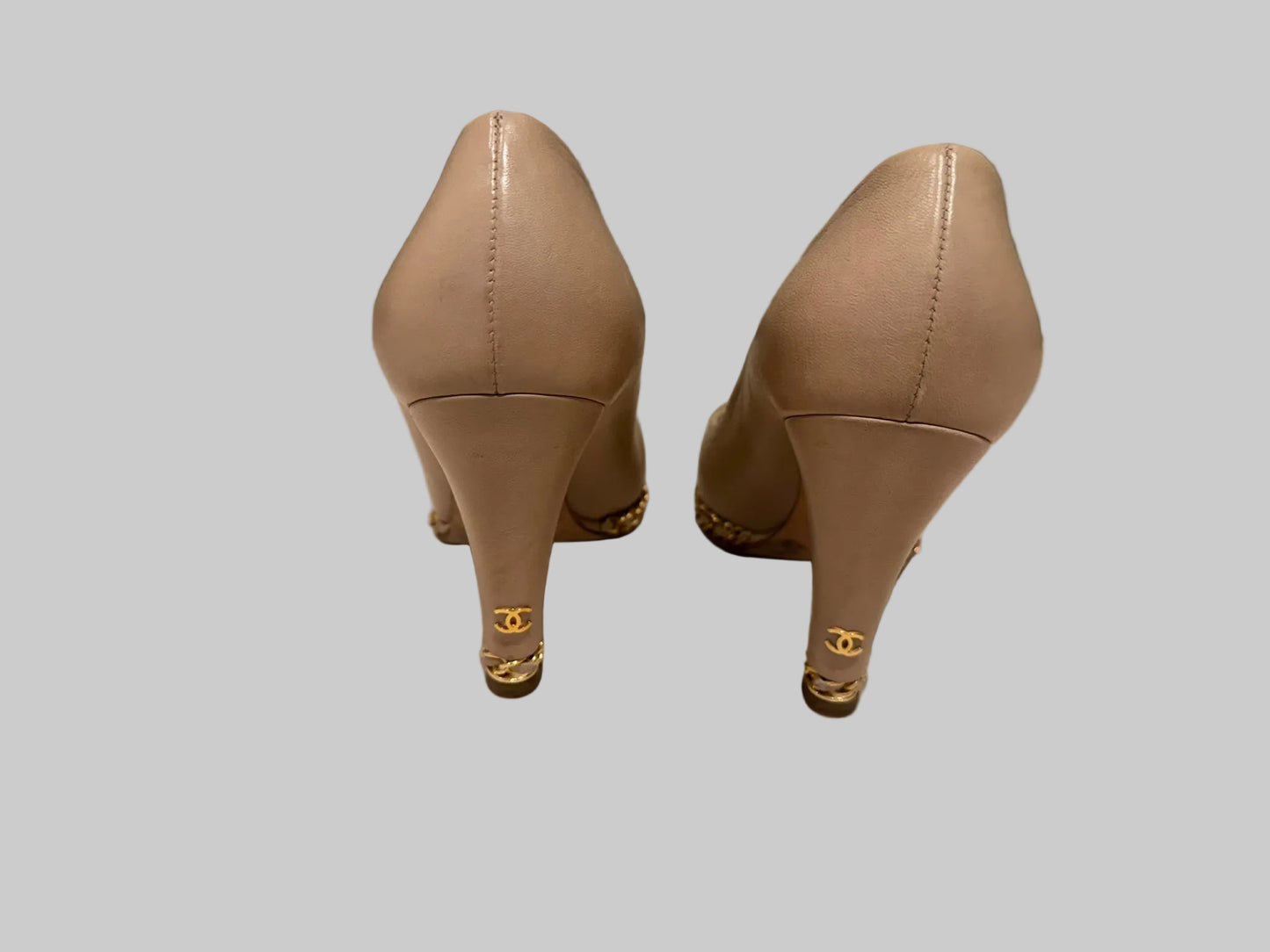 Chanel CC logo gold heel detail on beige platform pumps