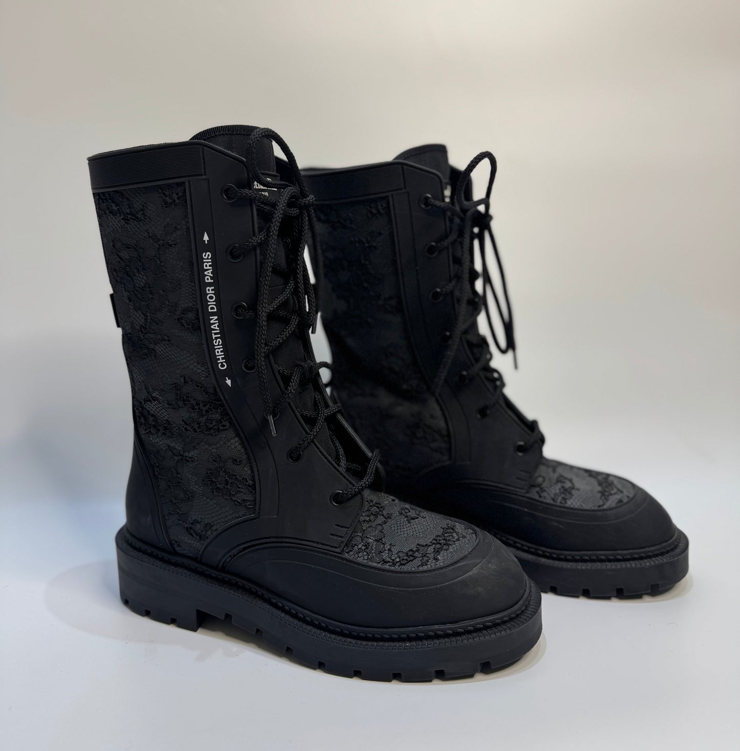 Christian Dior Black Lace Rubber Combat Boots Size 38 – Luxury Italian designer boots with lace-up style, durable rubber material, gripped soles for traction, and iconic CD logo. Stylish, versatile, and perfect for any occasion.