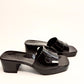 Side view of GUCCI black rubber logo slide sandals with embossed logo, size 38