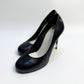 A pair of CHANEL black leather pumps