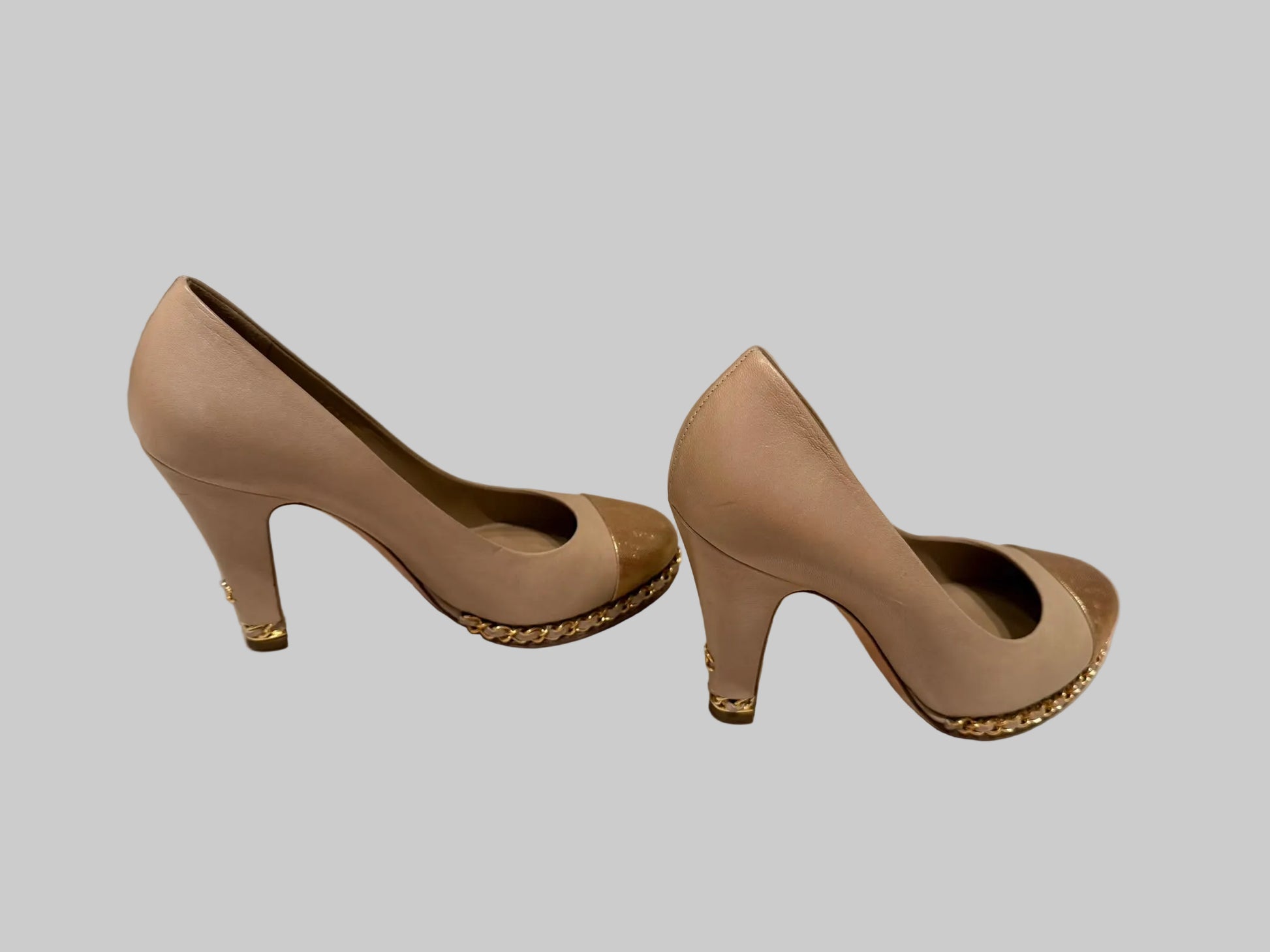 Chanel beige gold cap toe pumps with chain trim and block heel side view
