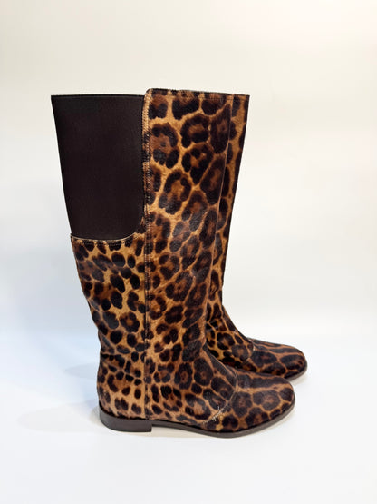 Side angle of the leopard print boots, highlighting the soft calf hair texture and knee-high design.