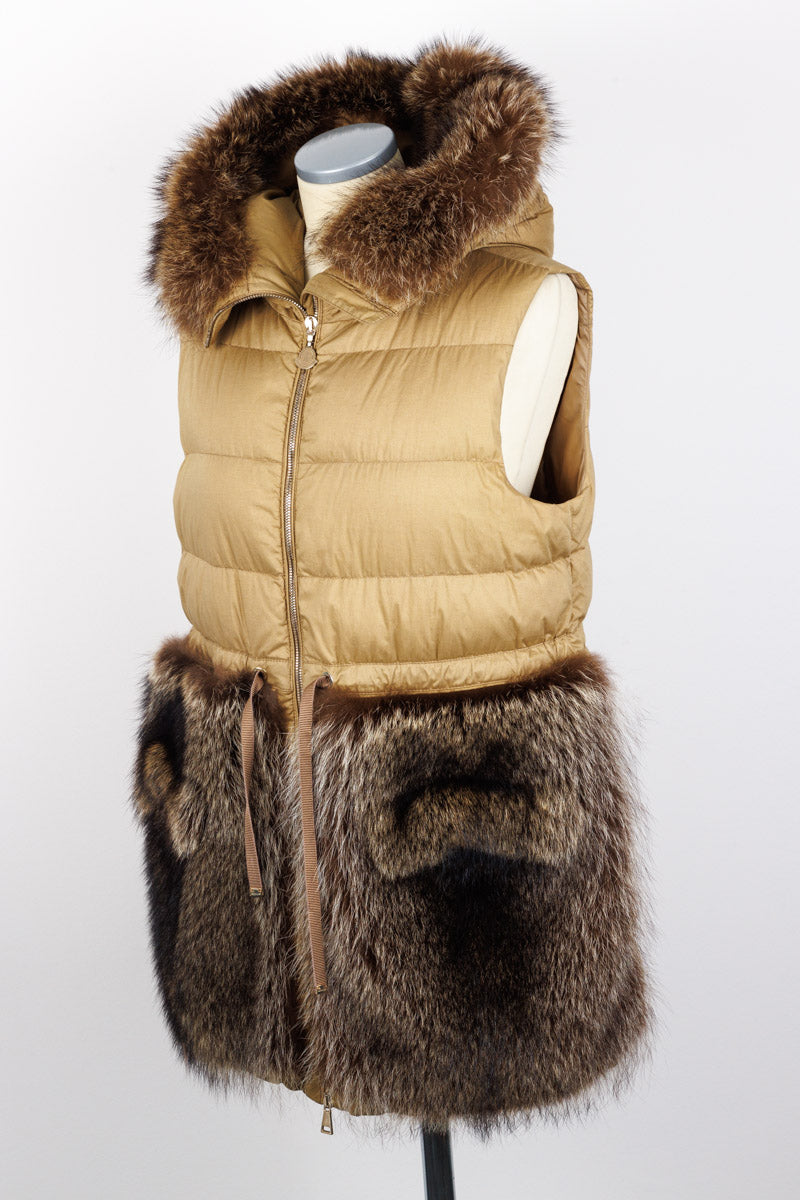 MONCLER luxury long quilted vest with real marmot fur inserts on the hood, beige color, size 3, in excellent condition. Features a front zip closure, drawstring waist, and practical snap flap pockets.