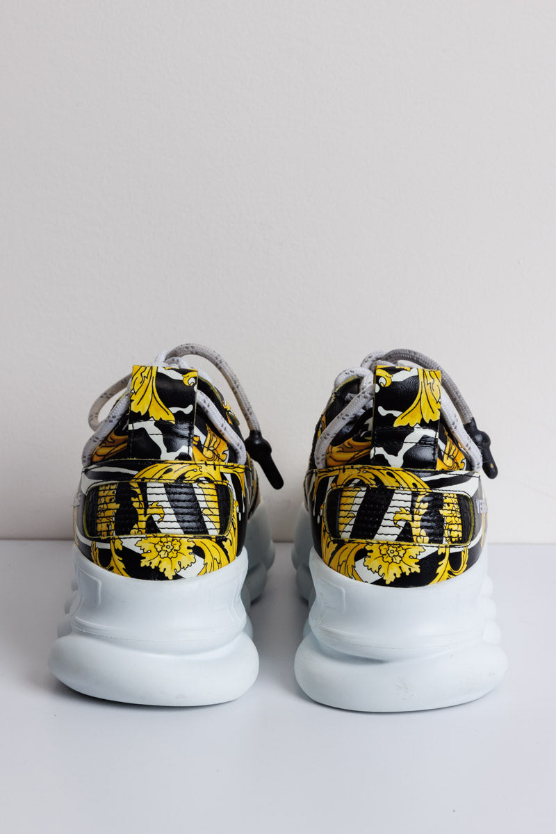 VERSACE Baskets jaunes et noires Chain Barocco Reaction